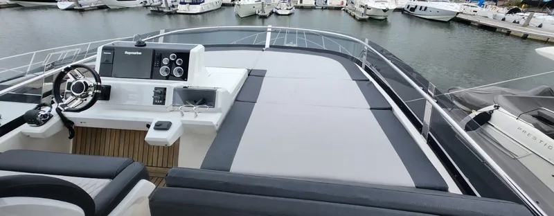  Yacht Photos Pics 2017 Galeon 550 Fly yacht's spacious flybridge with helm and seating area.