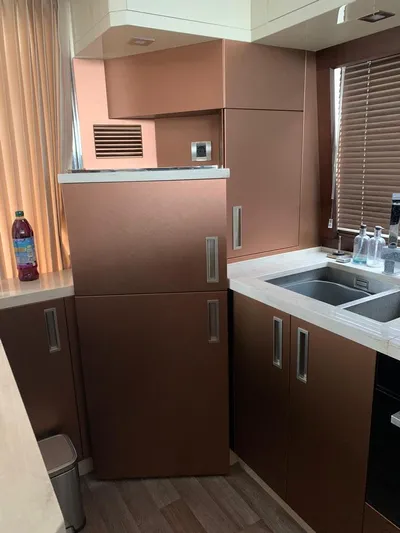  Yacht Photos Pics Modern kitchen interior on 2017 Galeon 550 Fly yacht with sleek cabinetry and sink.