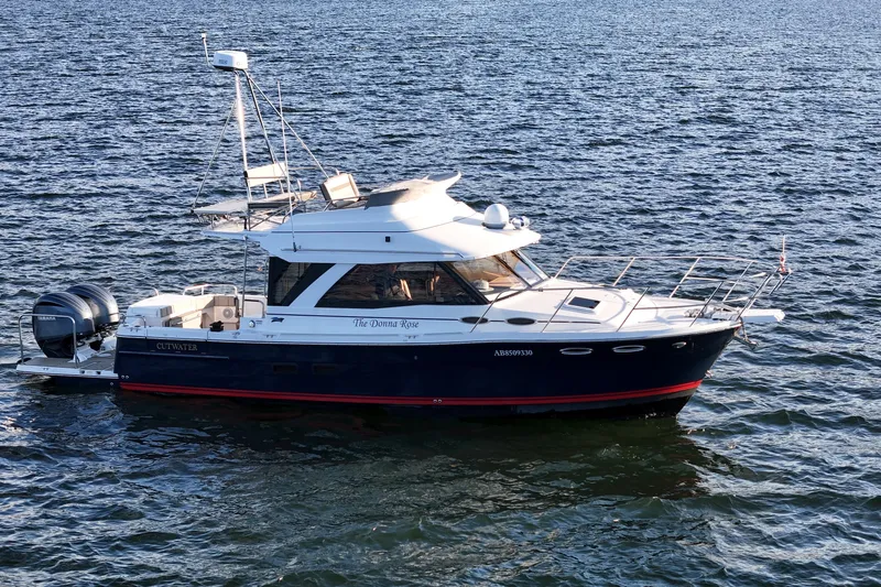  Yacht Photos Pics 2022 Cutwater C-32 CB boat cruising on open water.