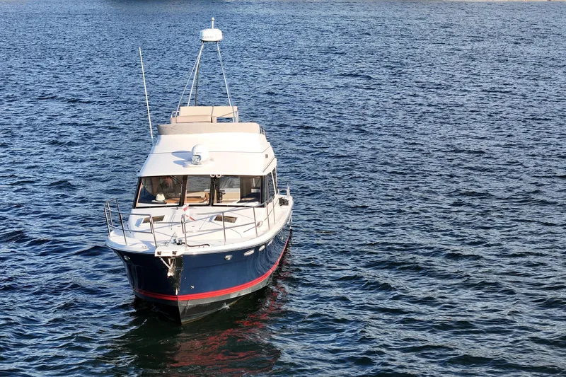  Yacht Photos Pics 2022 Cutwater C-32 CB boat on open water, showcasing sleek design and modern features.