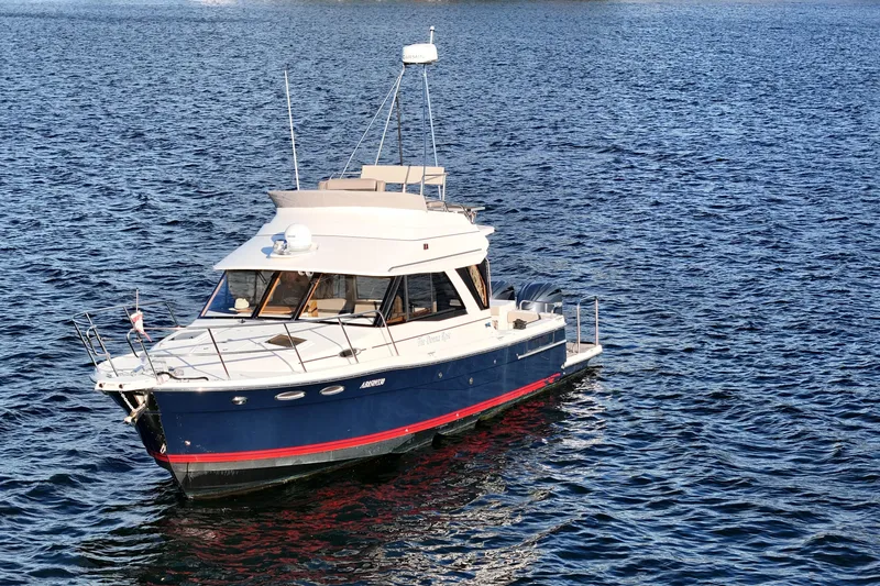  Yacht Photos Pics 2022 Cutwater C-32 CB boat on open water, featuring sleek design and modern amenities.