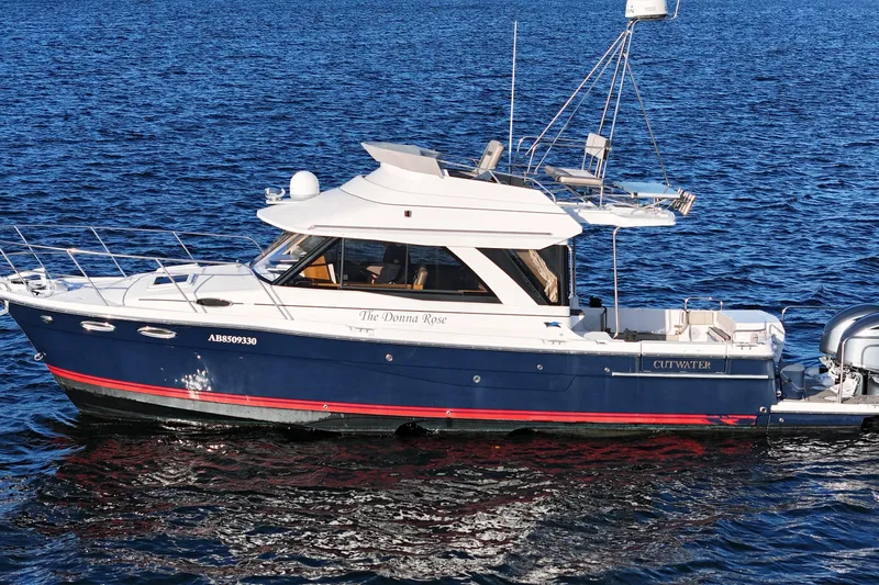  Yacht Photos Pics 2022 Cutwater C-32 CB boat cruising on blue water.