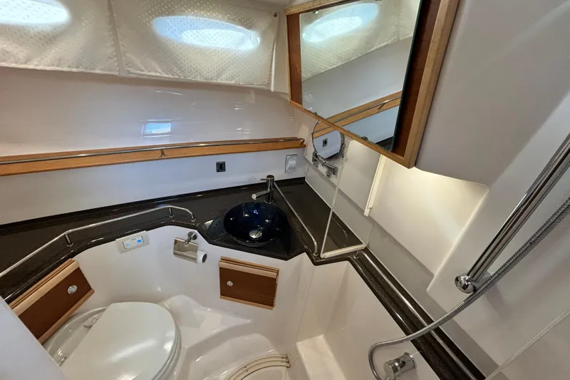  Yacht Photos Pics 2022 Cutwater C-32 CB boat bathroom with modern fixtures and compact design.