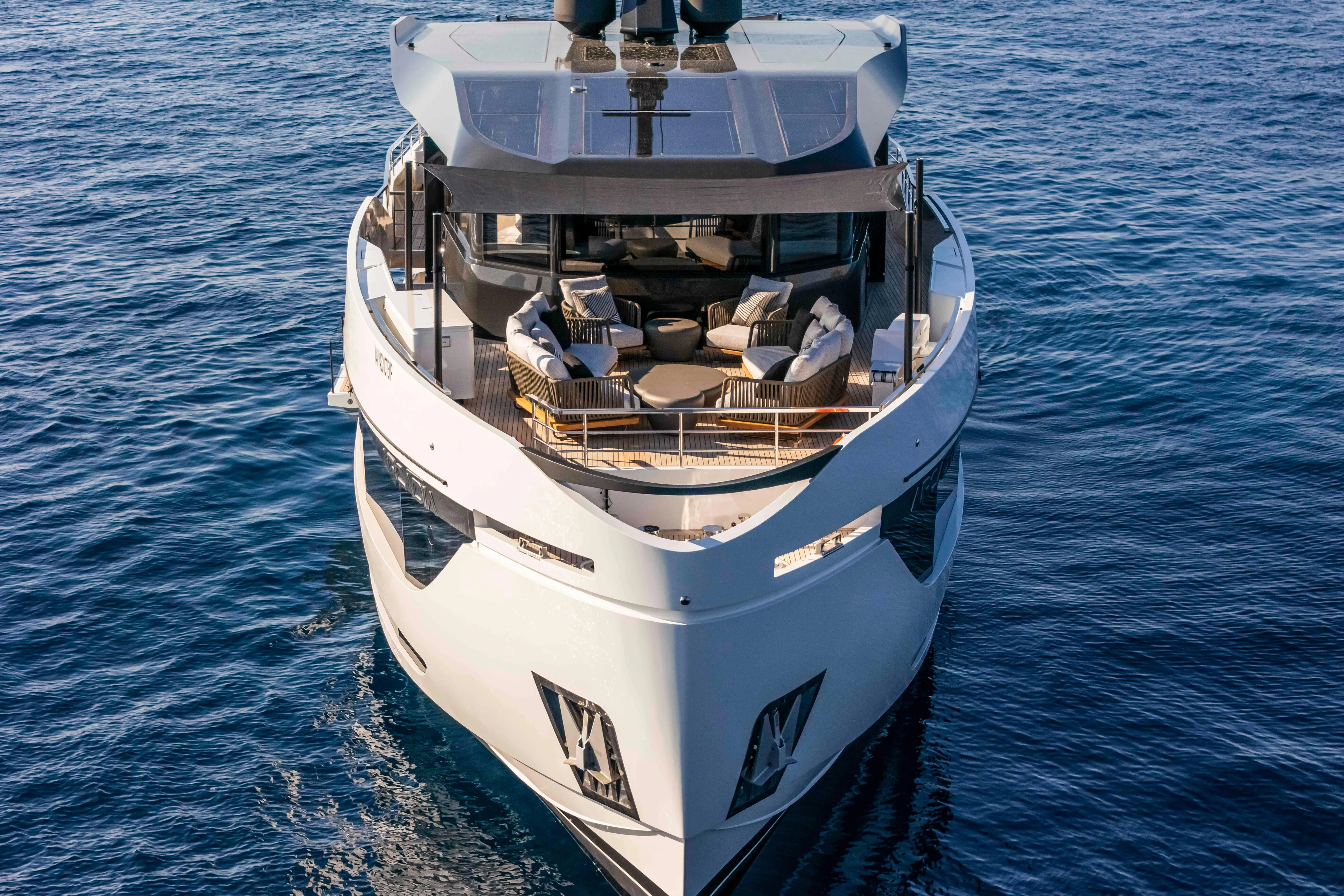  Yacht Photos Pics Luxurious 2024 Arcadia Yachts A96 on serene blue waters, showcasing elegant design and spacious deck.