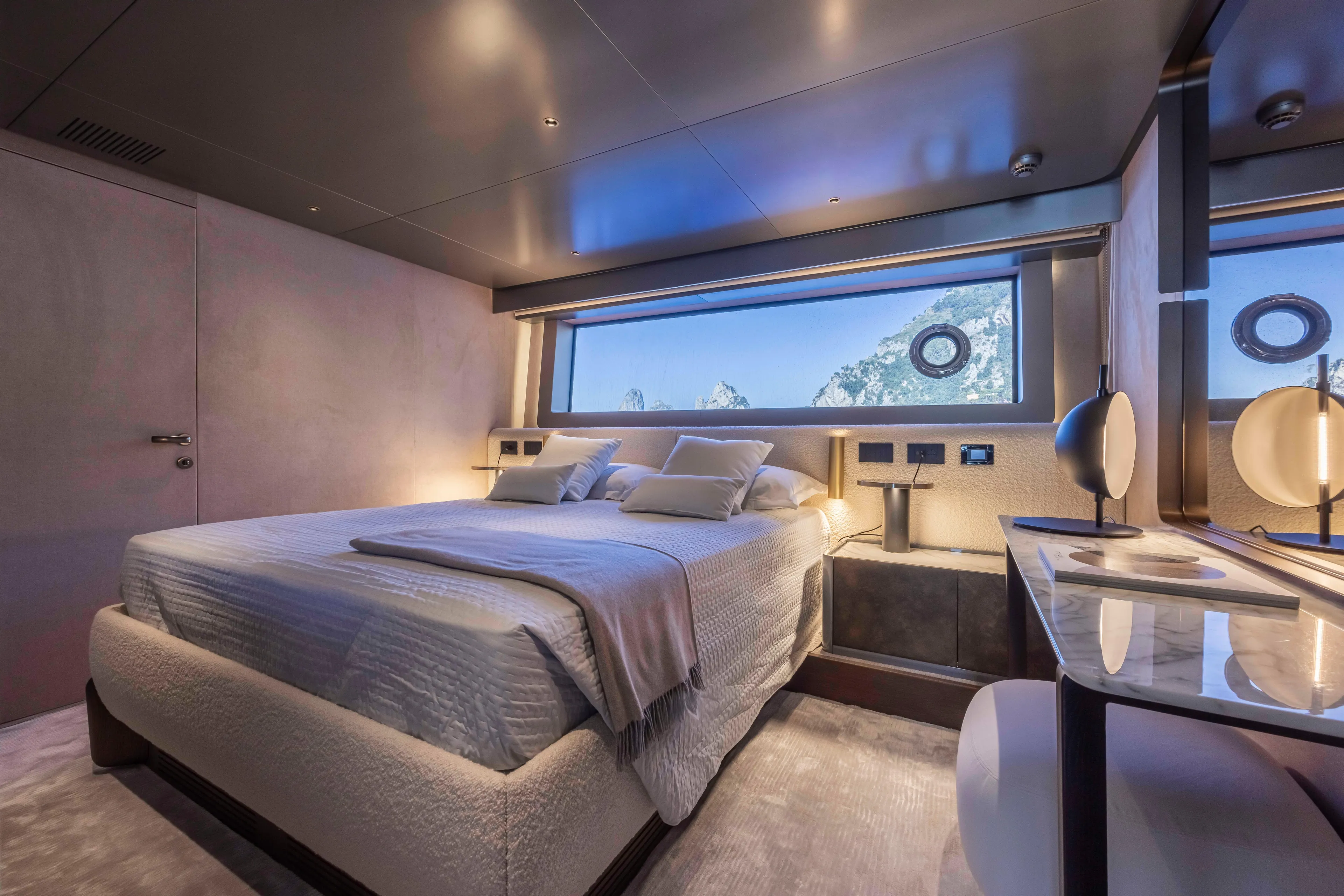  Yacht Photos Pics Luxurious bedroom interior of 2024 Arcadia Yachts A96, featuring modern design and scenic window view.