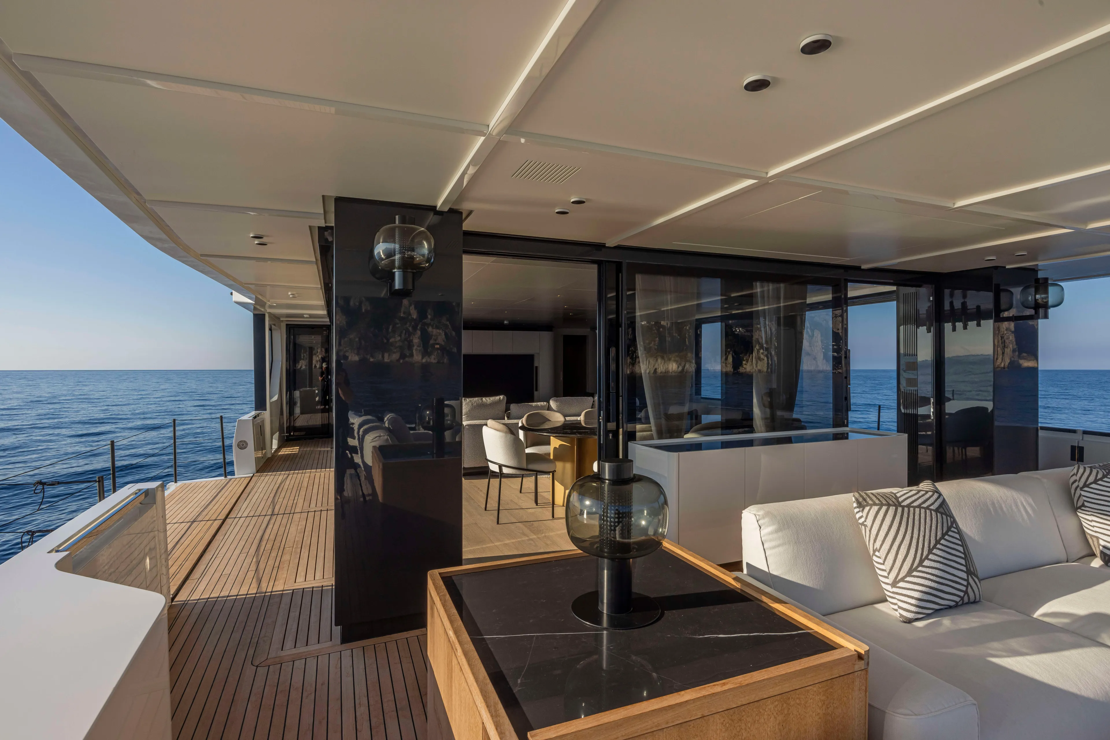  Yacht Photos Pics Luxurious 2024 Arcadia A96 yacht interior with ocean view, featuring elegant seating and modern design.