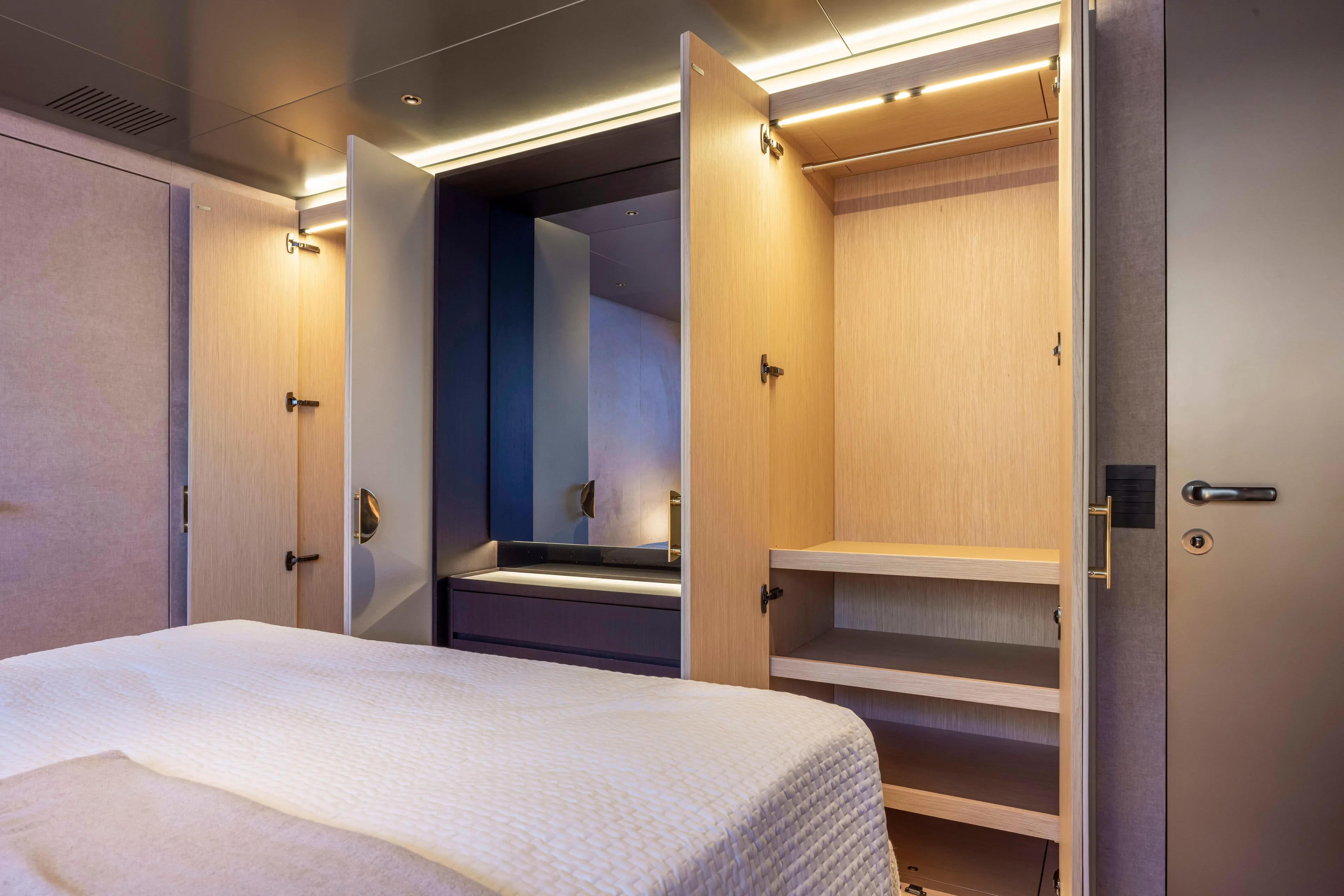  Yacht Photos Pics Luxurious bedroom interior of 2024 Arcadia Yachts A96, featuring open wardrobe and modern design.