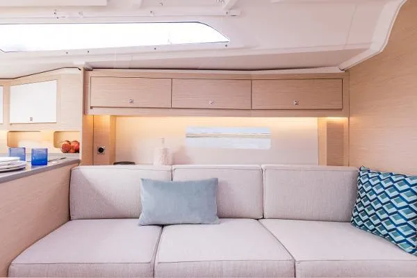 In Stock #74 Yacht Photos Pics Interior of 2024 Dufour 37 yacht with modern beige sofa and stylish decor.