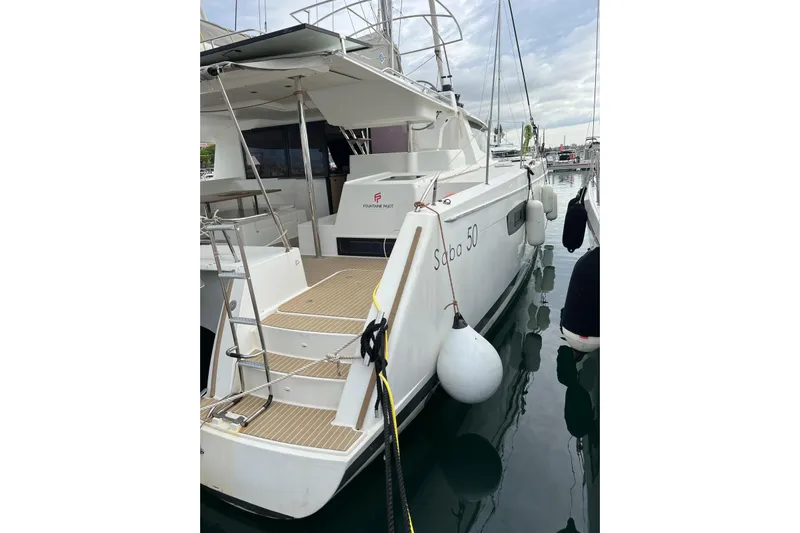 B&b Yachts Yacht Photos Pics 2019 Fountaine Pajot SABA 50 catamaran docked, showcasing sleek design and spacious deck.