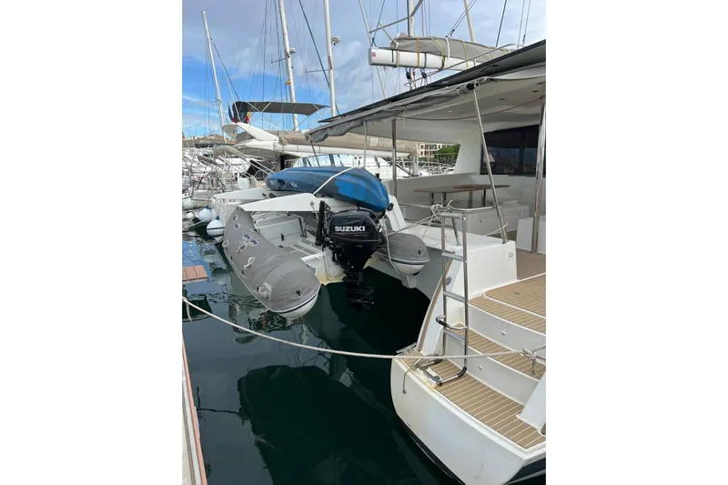 B&b Yachts Yacht Photos Pics 2019 Fountaine Pajot SABA 50 catamaran docked with inflatable boat and Suzuki motor.