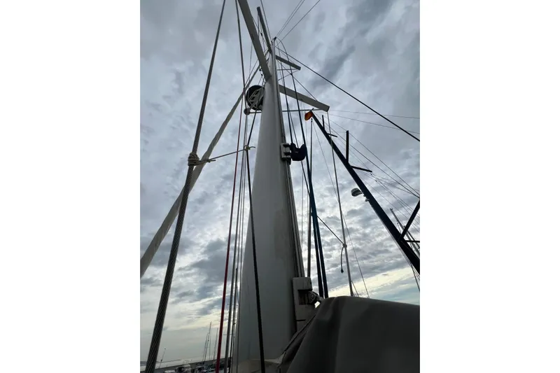 B&b Yachts Yacht Photos Pics Mast of 2019 Fountaine Pajot SABA 50 sailboat against cloudy sky.