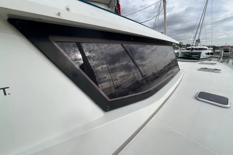 B&b Yachts Yacht Photos Pics 2019 Fountaine Pajot SABA 50 catamaran with marina reflection on window.