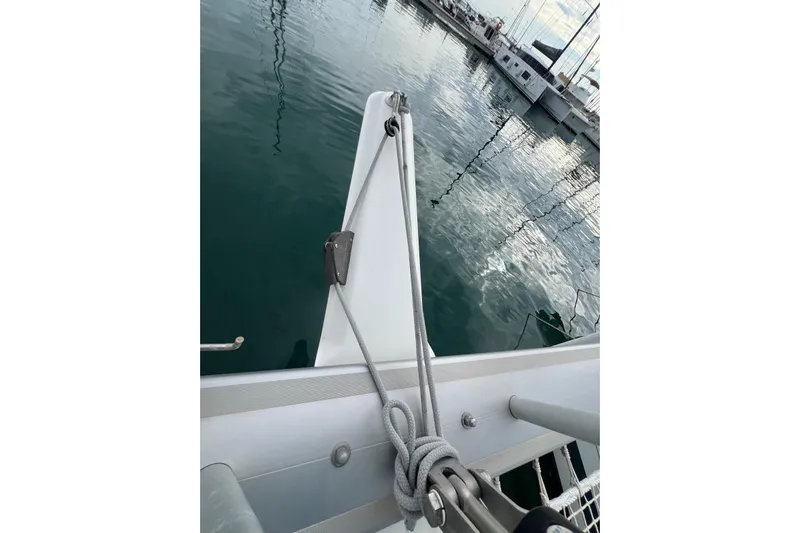 B&b Yachts Yacht Photos Pics Bow of 2019 Fountaine Pajot SABA 50 catamaran with ropes and calm marina waters.