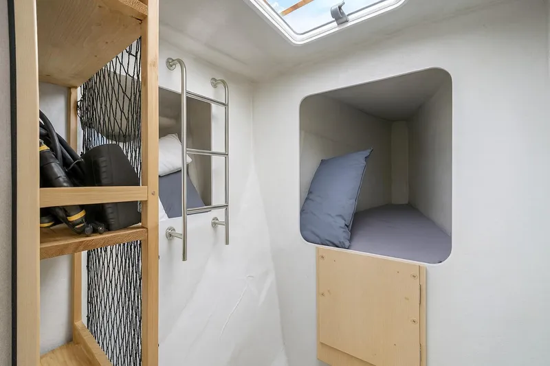 B&b Yachts Yacht Photos Pics Interior cabin of 2019 Fountaine Pajot SABA 50 with storage and sleeping area.