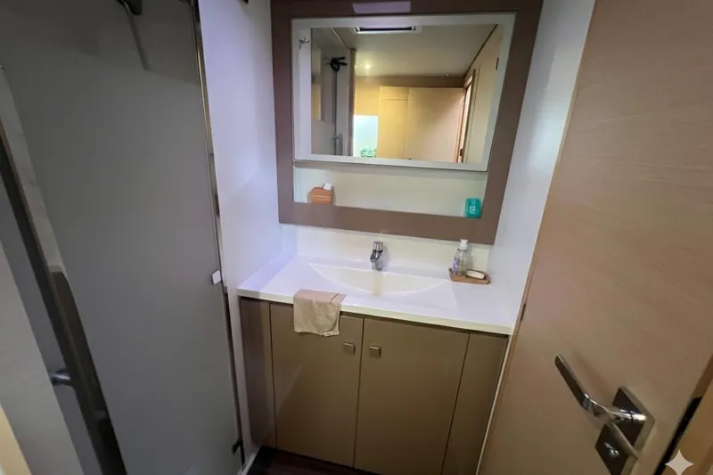 B&b Yachts Yacht Photos Pics Bathroom interior of 2019 Fountaine Pajot SABA 50 catamaran, featuring modern sink and mirror.