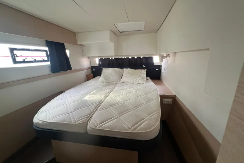 B&b Yachts Yacht Photos Pics Interior cabin of 2019 Fountaine Pajot SABA 50 catamaran with double bed and windows.