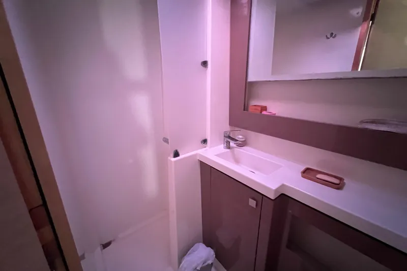 B&b Yachts Yacht Photos Pics Bathroom interior of 2019 Fountaine Pajot SABA 50 yacht, featuring modern sink and shower.