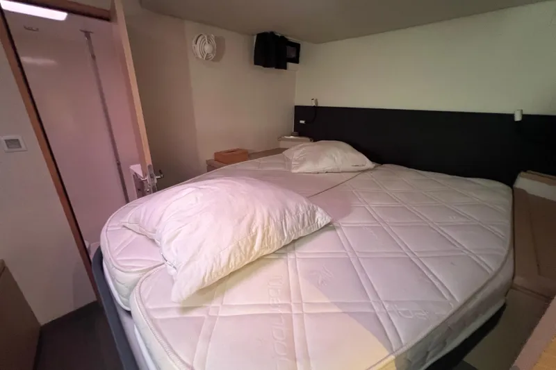 B&b Yachts Yacht Photos Pics Interior cabin of 2019 Fountaine Pajot SABA 50 catamaran with cozy bed setup.