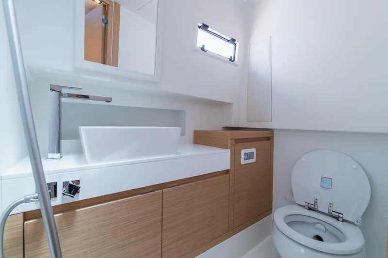  Yacht Photos Pics Modern bathroom interior of 2025 Pardo Yachts P38, featuring sleek sink and toilet design.