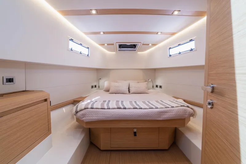  Yacht Photos Pics Luxurious interior cabin of 2025 Pardo Yachts P38, featuring modern design and cozy bedding.