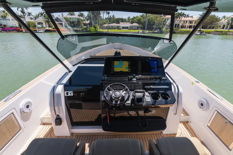  Yacht Photos Pics 2025 Pardo Yachts P38 helm with modern navigation system on a serene waterway.