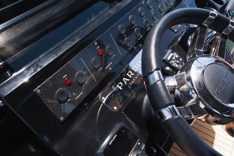  Yacht Photos Pics 2025 Pardo Yachts P38 dashboard with steering wheel and control panel.