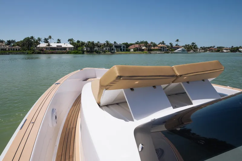  Yacht Photos Pics 2025 Pardo Yachts P38 luxury yacht with sun loungers on a serene waterway.