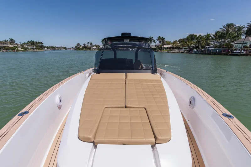  Yacht Photos Pics 2025 Pardo Yachts P38 with sunbed, cruising on a serene waterway.