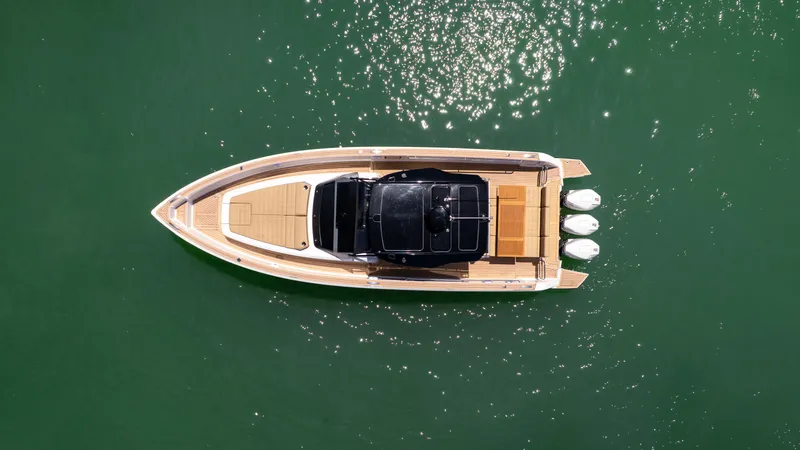  Yacht Photos Pics Overhead view of 2025 Pardo Yachts P38 on green water, showcasing sleek design and triple engines.