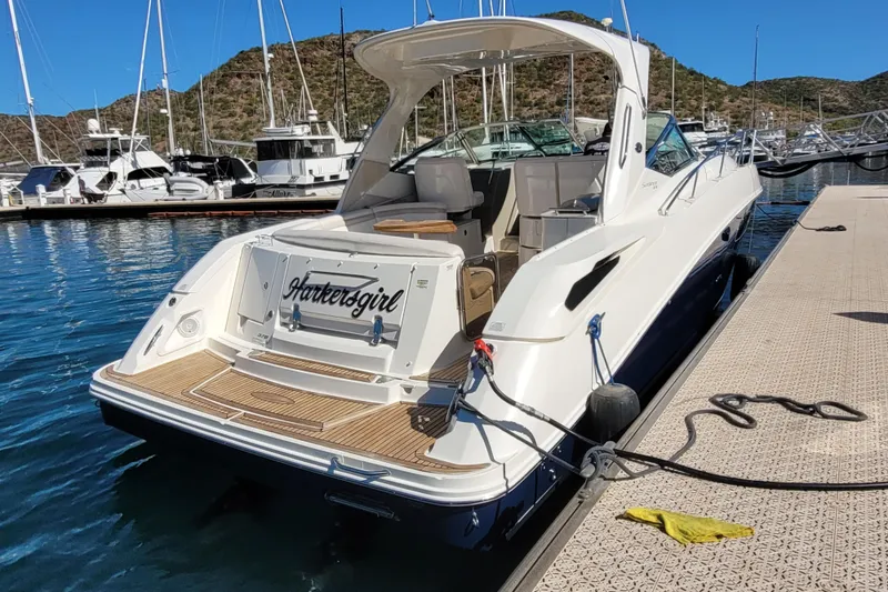  Yacht Photos Pics 2011 Sea Ray 370 Sundancer yacht docked at marina, sunny day, scenic background.