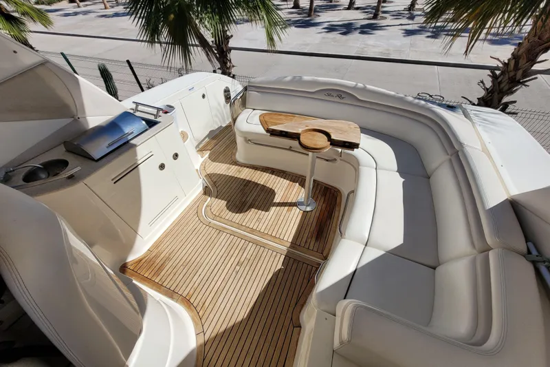  Yacht Photos Pics Luxurious 2011 Sea Ray 370 Sundancer yacht interior with teak flooring and plush seating.