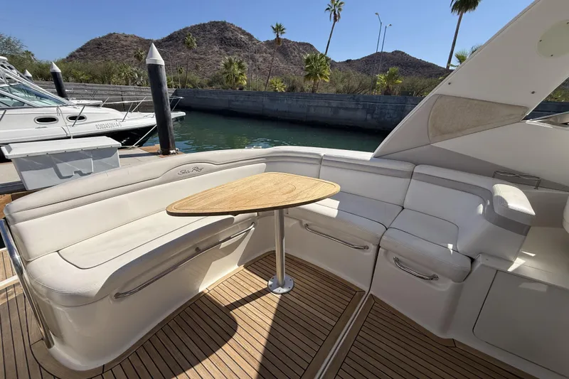  Yacht Photos Pics Luxurious 2011 Sea Ray 370 Sundancer yacht interior with elegant seating and wooden table.