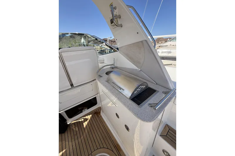  Yacht Photos Pics Luxury outdoor kitchen on 2011 Sea Ray 370 Sundancer yacht, featuring grill and sink.