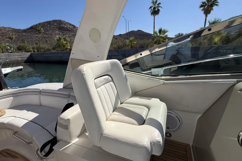  Yacht Photos Pics Luxury 2011 Sea Ray 370 Sundancer boat interior with white seating and scenic background.