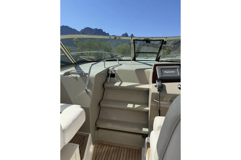  Yacht Photos Pics Interior view of 2011 Sea Ray 370 Sundancer boat with navigation equipment and steps.