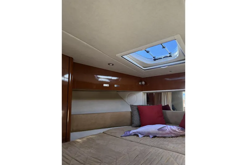  Yacht Photos Pics Interior cabin of 2011 Sea Ray 370 Sundancer with skylight and cushions.