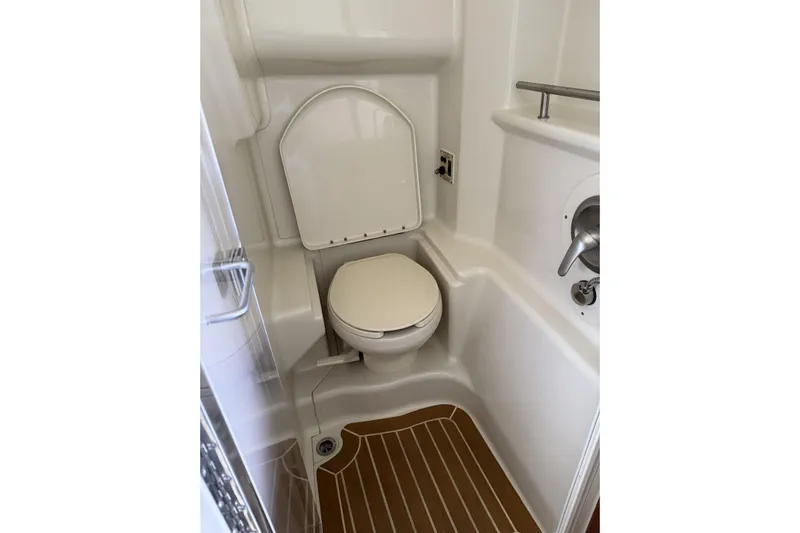  Yacht Photos Pics Compact bathroom in 2011 Sea Ray 370 Sundancer yacht with toilet and shower.