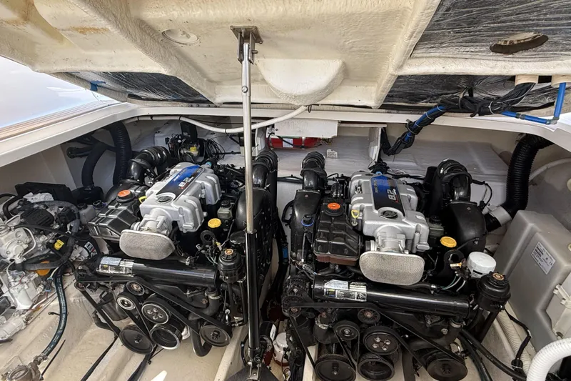 Yacht Photos Pics Engine compartment of a 2011 Sea Ray 370 Sundancer boat, showcasing dual engines.