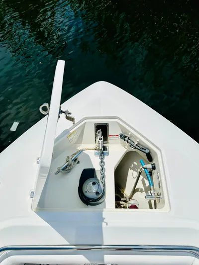  Yacht Photos Pics 2016 Boston Whaler 350 Outrage anchor compartment with chain, docked on water.