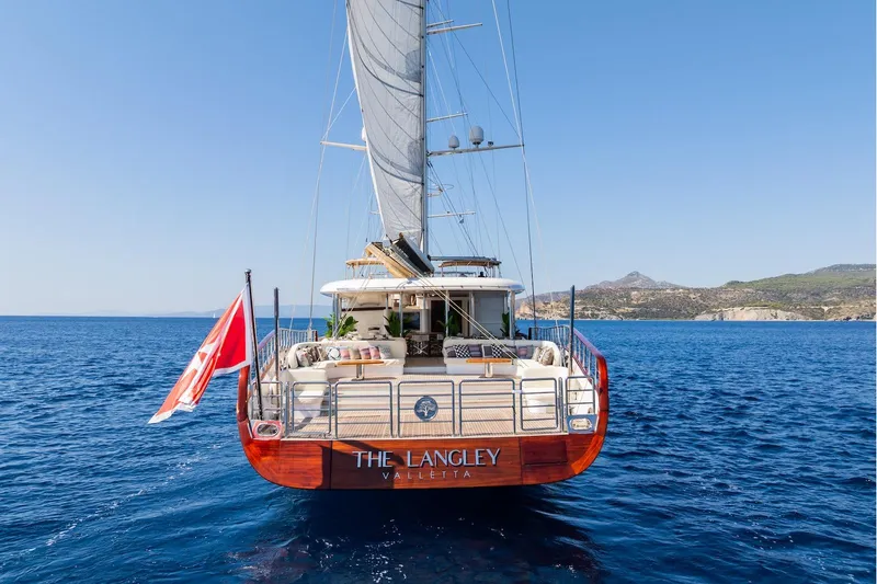 The Langley Yacht Photos Pics Aegean Yacht 3 Mast Schooner, 2009, sailing on blue sea near scenic coastline.