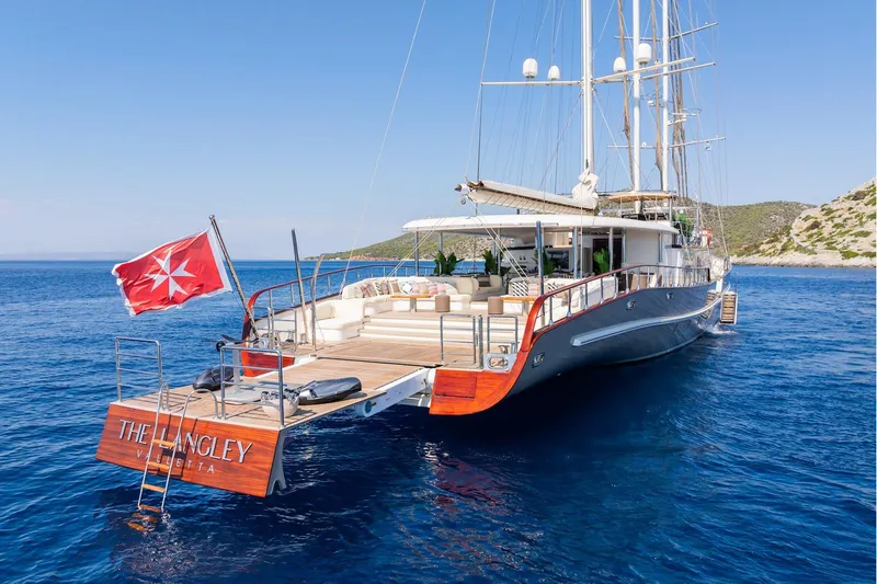 The Langley Yacht Photos Pics Luxurious 2009 Aegean Yacht 3 Mast Schooner anchored in clear blue waters.