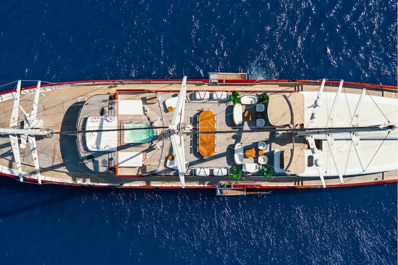 The Langley Yacht Photos Pics Aerial view of 2009 Aegean Yacht 3 Mast Schooner on blue ocean water.