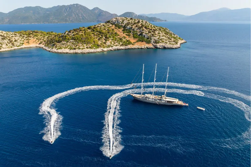 The Langley Yacht Photos Pics Aegean Yacht 3 Mast Schooner sailing near scenic island, 2009 model.