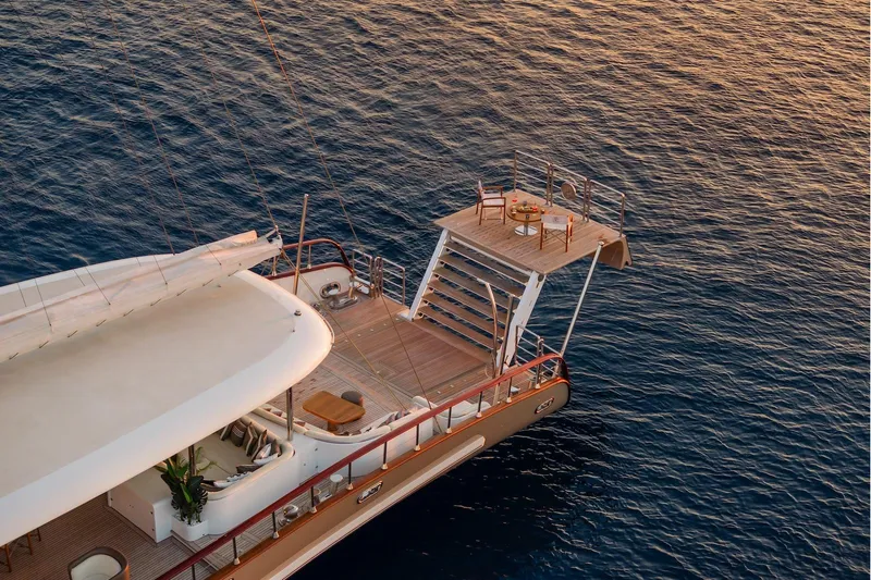 The Langley Yacht Photos Pics Luxurious 2009 Aegean Yacht 3 Mast Schooner with elegant deck overlooking serene ocean.