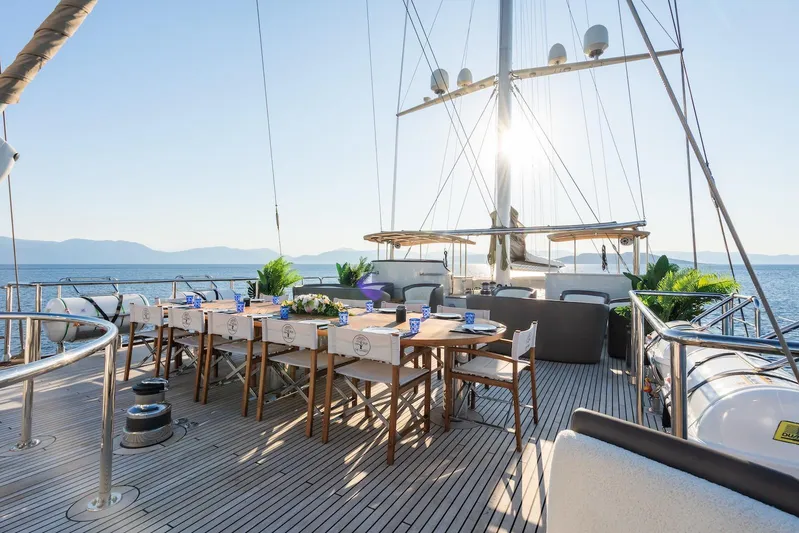 The Langley Yacht Photos Pics Luxurious deck of 2009 Aegean Yacht 3 Mast Schooner with elegant dining setup.