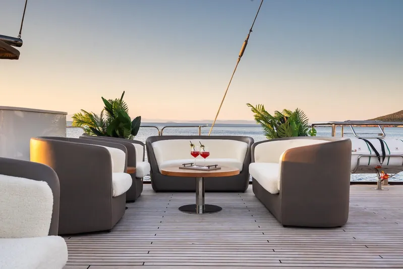 The Langley Yacht Photos Pics Luxurious deck seating on 2009 Aegean Yacht 3 Mast Schooner at sunset.