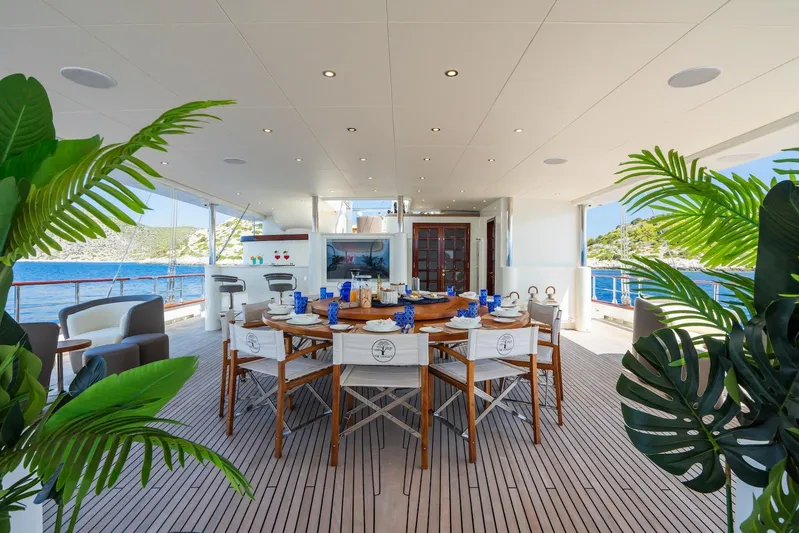 The Langley Yacht Photos Pics Luxurious dining area on 2009 Aegean Yacht 3 Mast Schooner, featuring elegant table setting and ocean view.