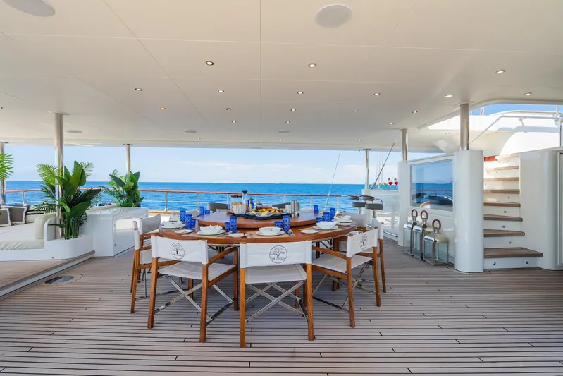 The Langley Yacht Photos Pics Luxurious deck of 2009 Aegean Yacht 3 Mast Schooner with elegant dining setup and ocean view.