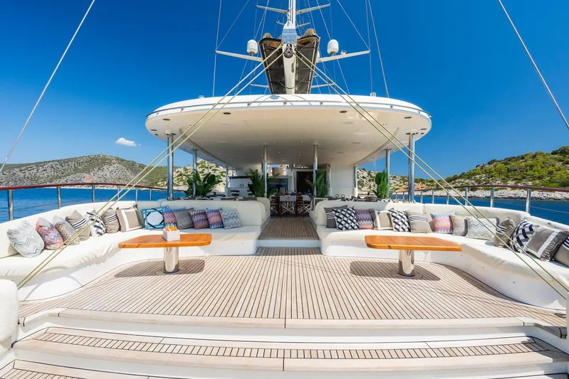 The Langley Yacht Photos Pics Luxurious 2009 Aegean Yacht 3 Mast Schooner with elegant deck seating and scenic ocean view.
