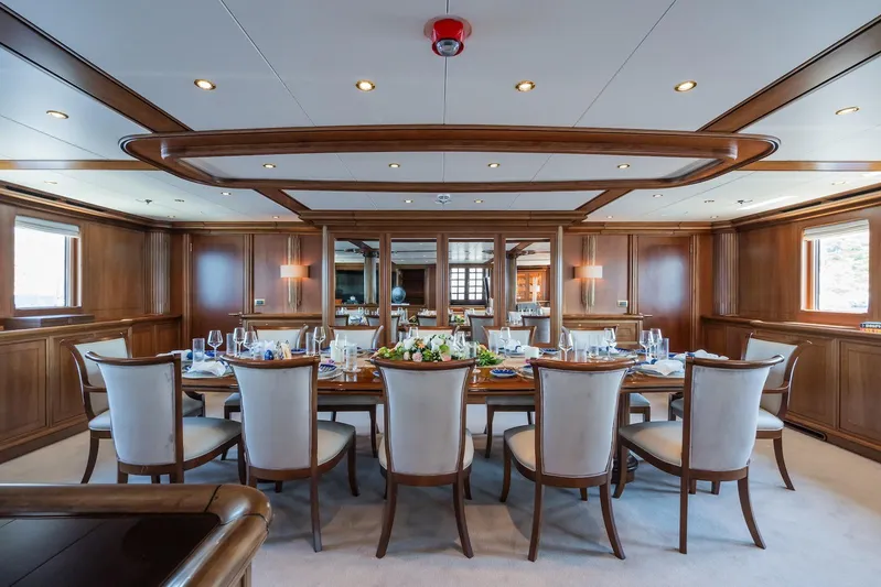 The Langley Yacht Photos Pics Luxurious dining area on 2009 Aegean Yacht 3 Mast Schooner, featuring elegant wood paneling.